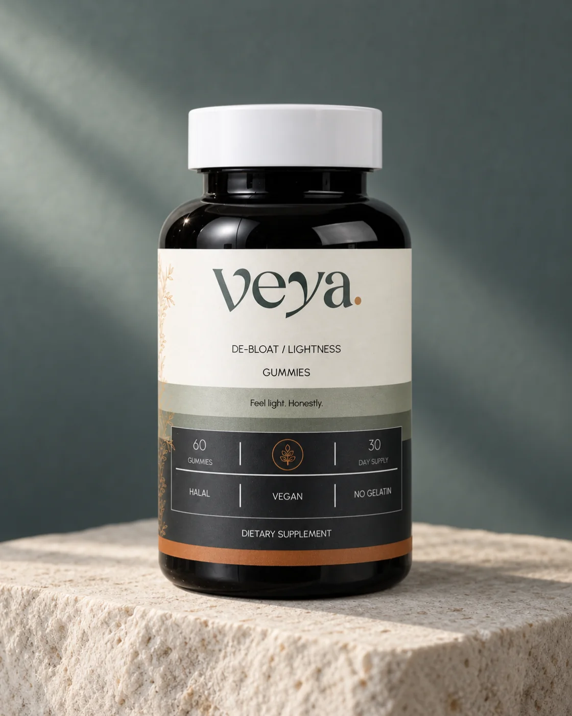 Veya bottle with its cream and slate label on a pale stone plinth against a soft slate backdrop.