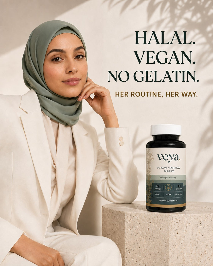 A woman seated beside the Veya jar on a stone plinth.