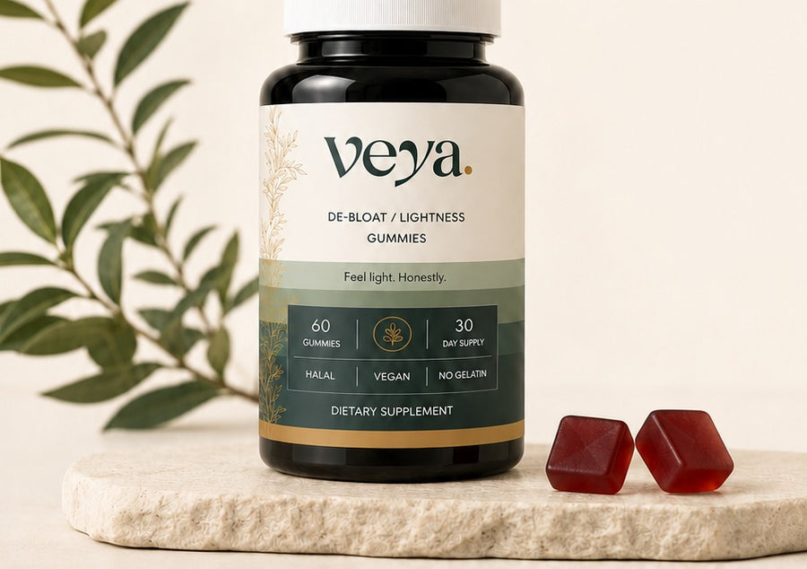 The Veya jar on a stone plinth with an olive branch behind it.