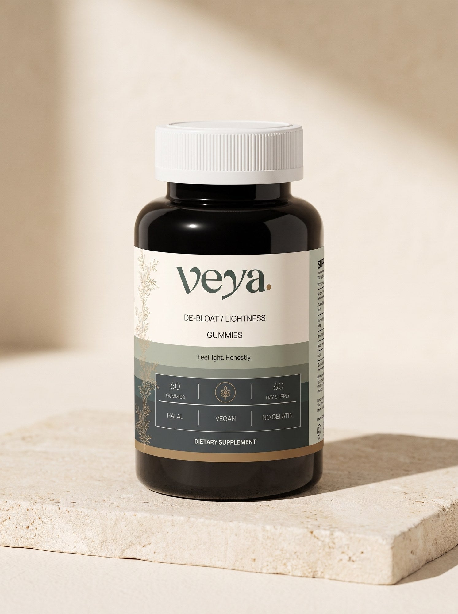 The Veya bottle at a three-quarter angle on a pale limestone slab in soft daylight