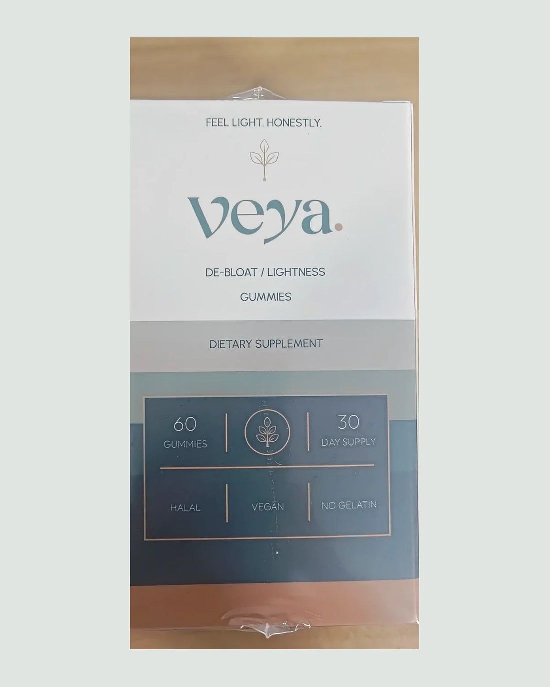 The Veya carton, front: feel light honestly, de-bloat and lightness gummies, sixty gummies, thirty-day supply.