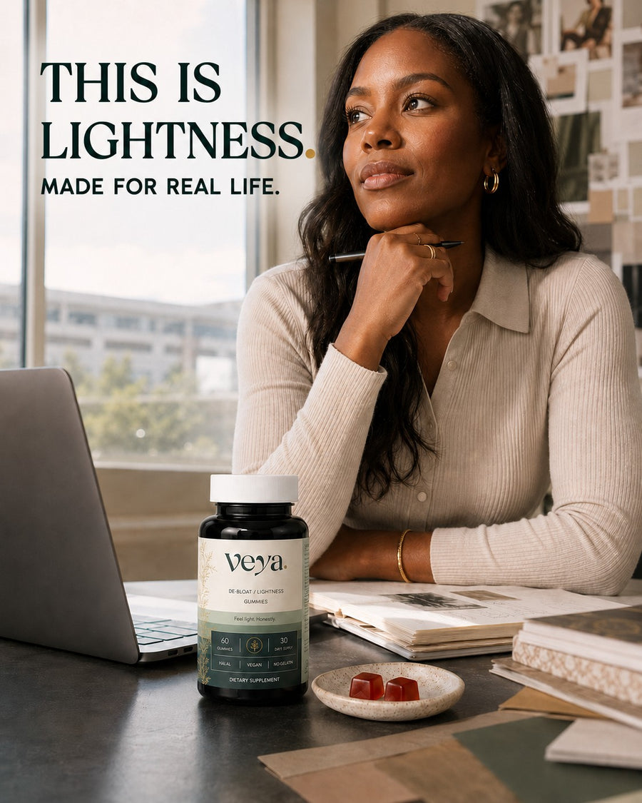 A woman at her desk with the Veya jar beside her.