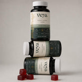 Three Veya jars stacked, with loose gummies beside them